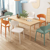 Scandinavian stackable side chair with open back made of plastic and acrylic for dining